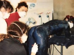 Applying Makeup To Rebecca Romijn On The Set Of The Film “X-Men”, 2000