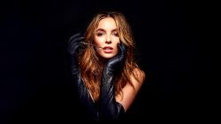 Jodie Comer Staring At Us, Open Mouthed, With Long Black Leather Gloves