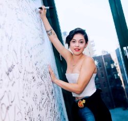 Rosa Salazar Signing A Wall